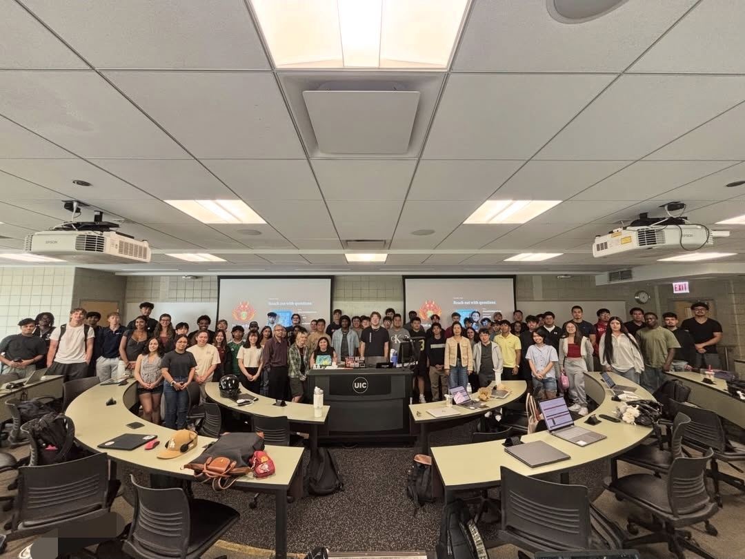Group photo of the Excel Club in a UIC lecture hall